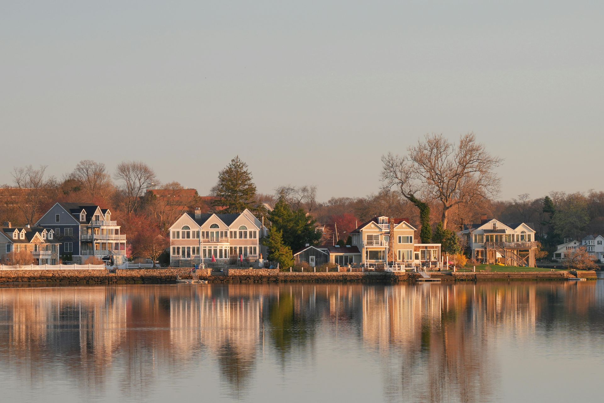 The skyline of New Jersey is reflected in a lake.