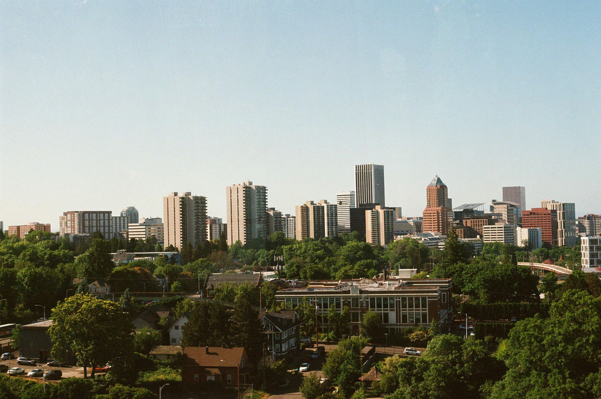 The skyline of New Jersey is reflected in a lake.