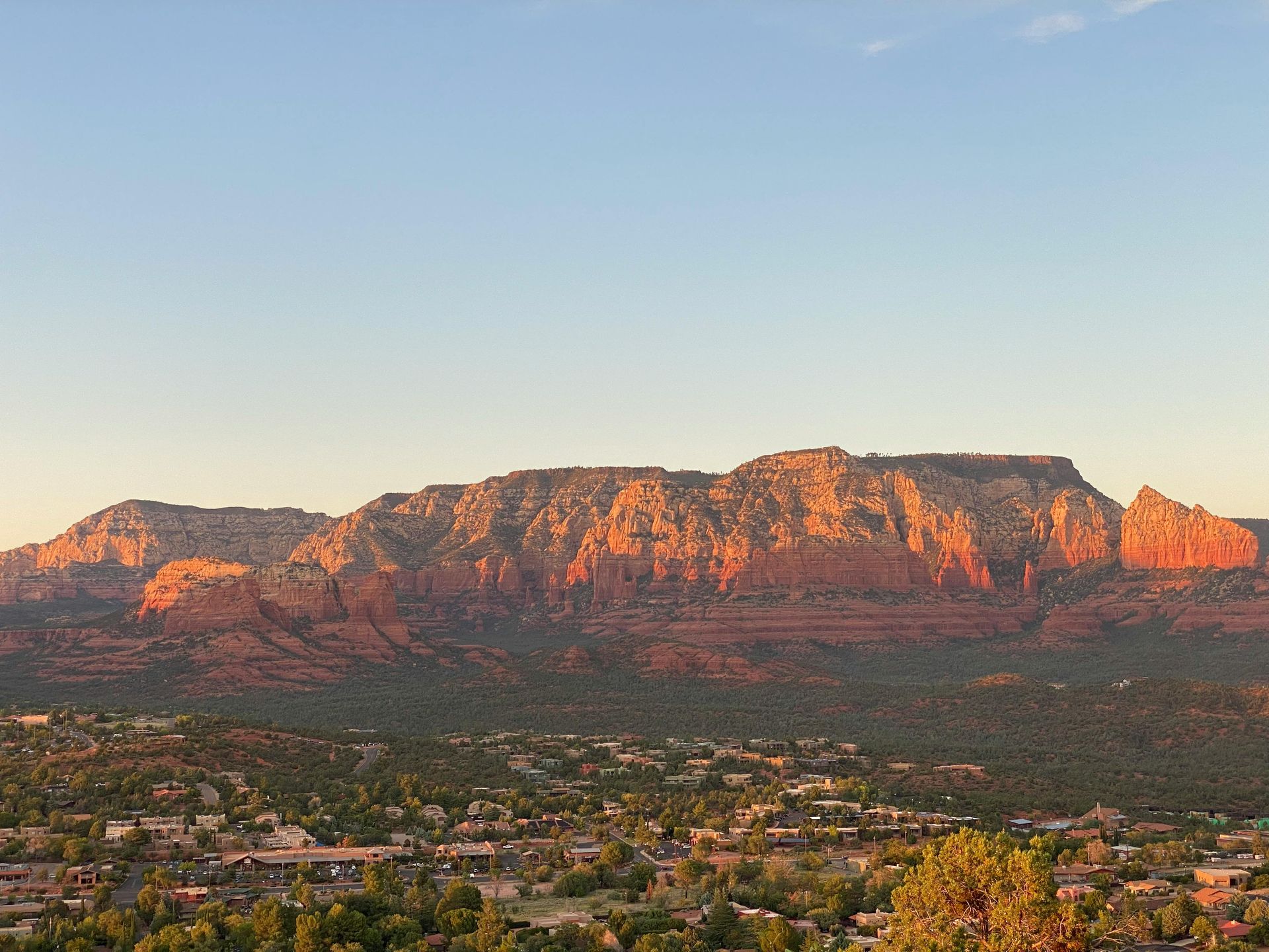 The skyline of New Jersey is reflected in a lake.