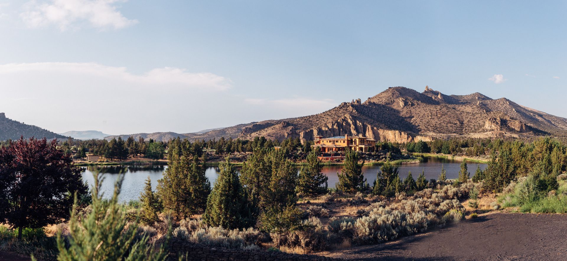 The skyline of New Jersey is reflected in a lake.