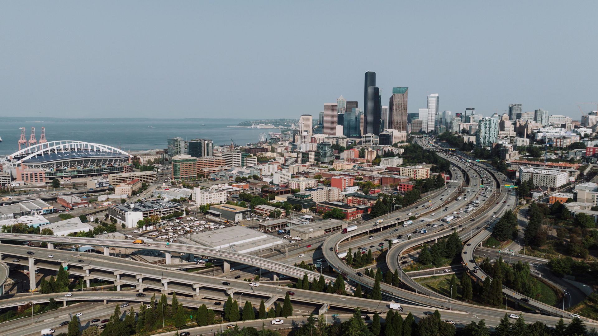 The skyline of New Jersey is reflected in a lake.
