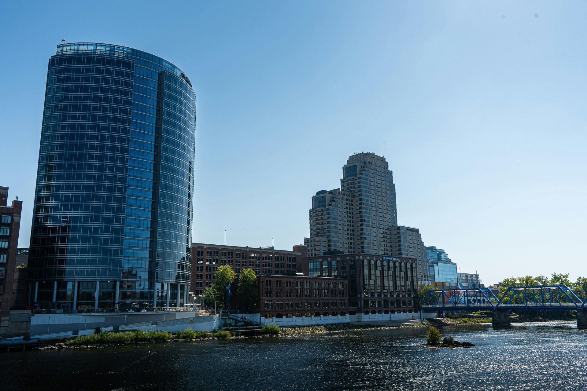 The skyline of New Jersey is reflected in a lake.