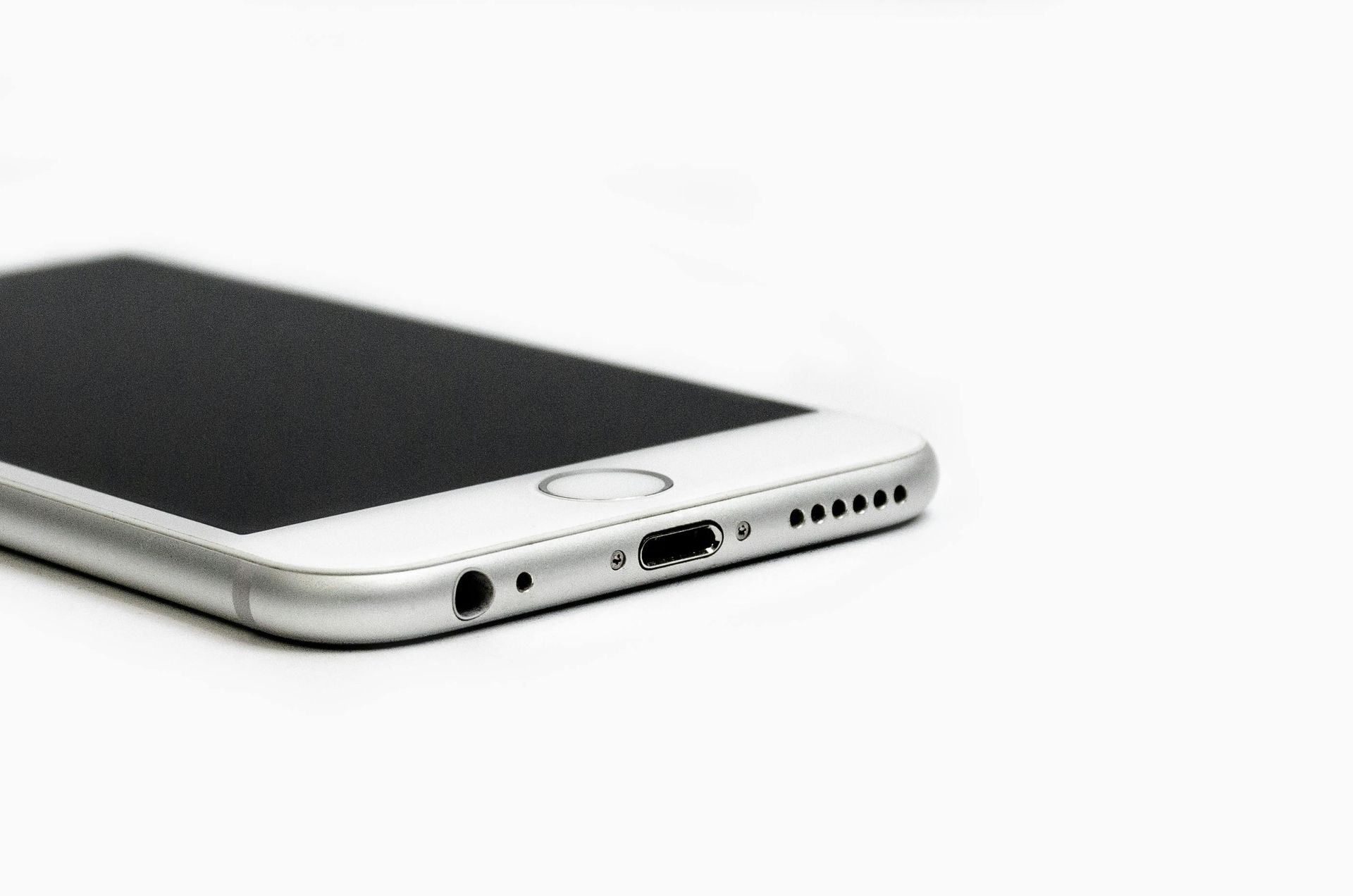 A close up of a cell phone on a white background