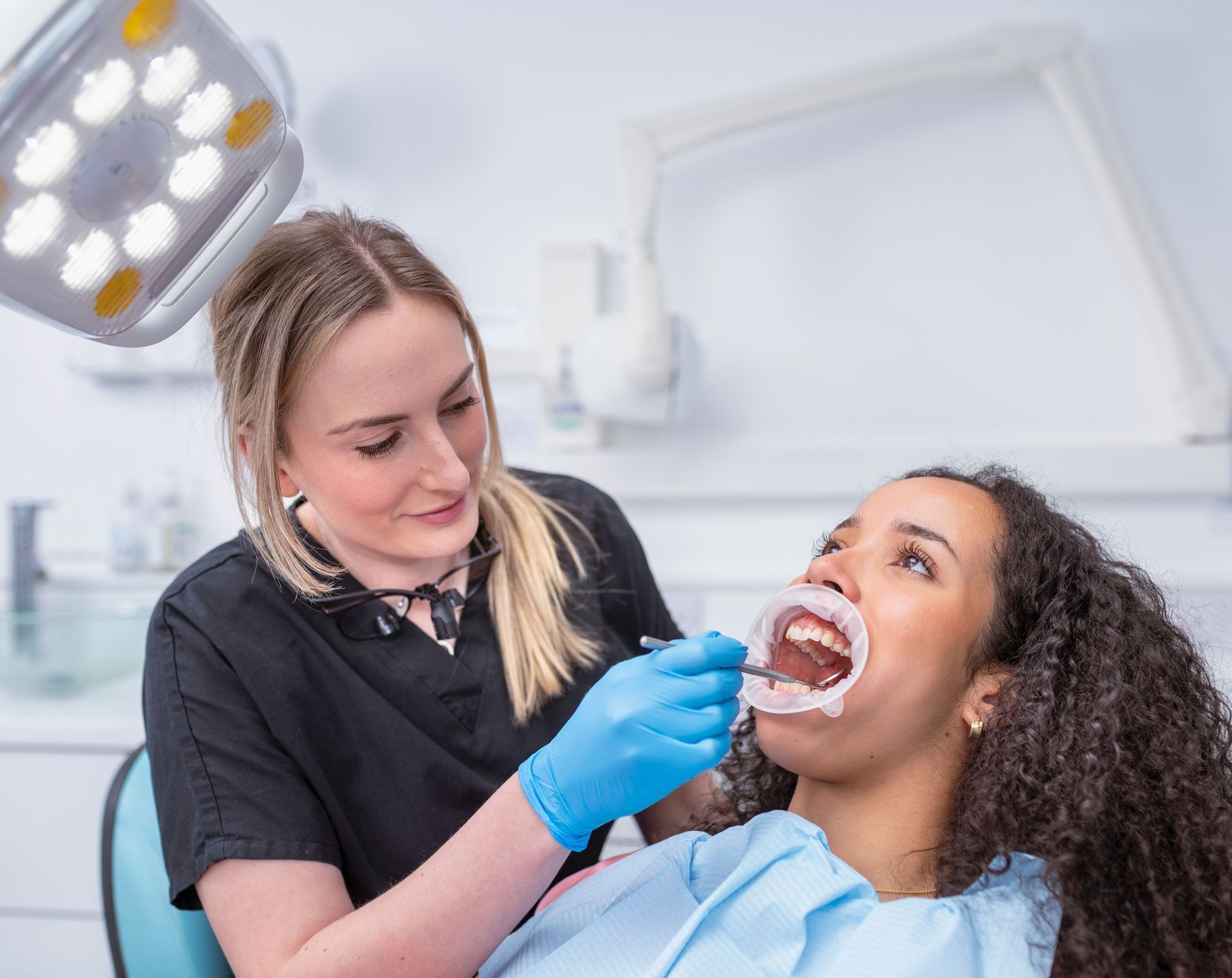 Female Dentist Checking Teeth — Redding, CA — Lake Boulevard Family Dentistry