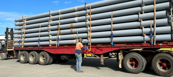 Loading FRP utility poles on the back of a truck