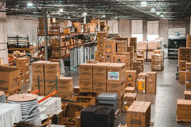 ARCO Distributing large warehouse filled with lots of boxes and shelves and parts.