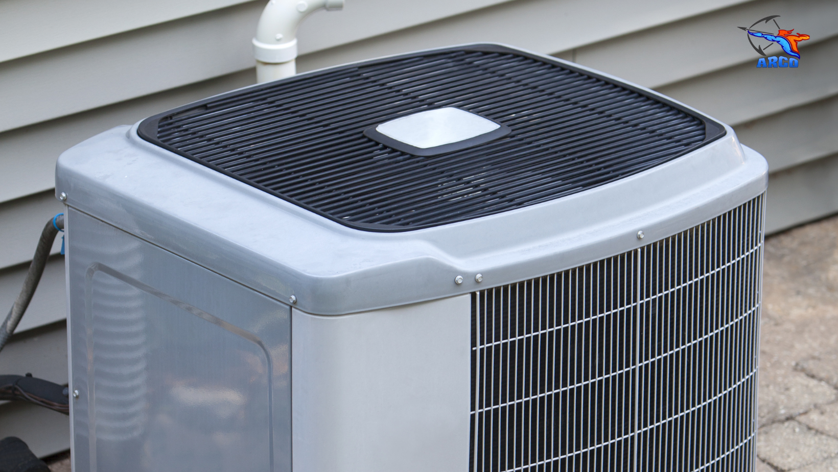 An air conditioner is sitting outside of a mobile home.