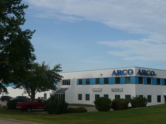 A large white building with the word arco on it