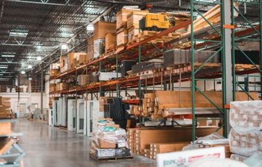 A warehouse filled with lots of boxes and shelves.