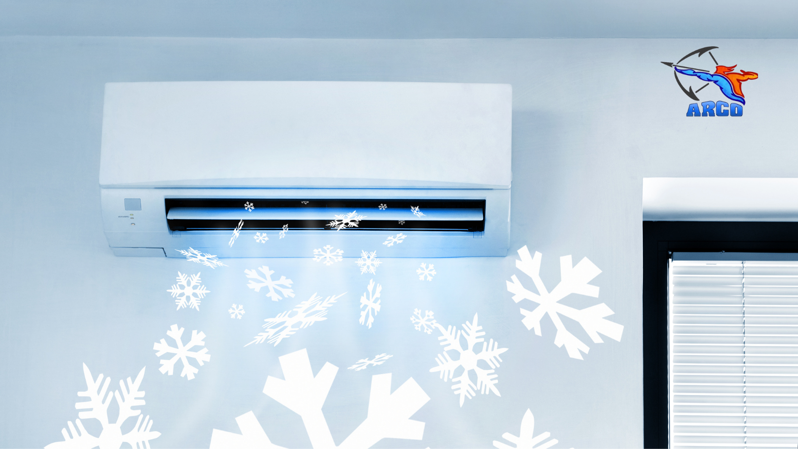 A wall mounted air conditioner with snowflakes coming out of it