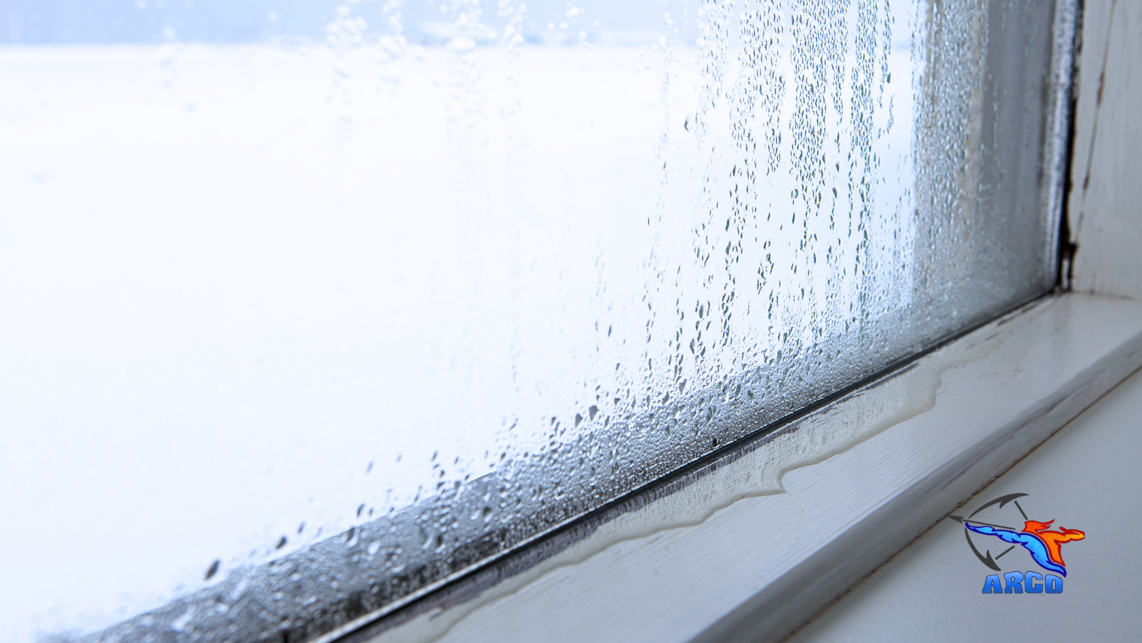 A close up of a window with water drops on it.