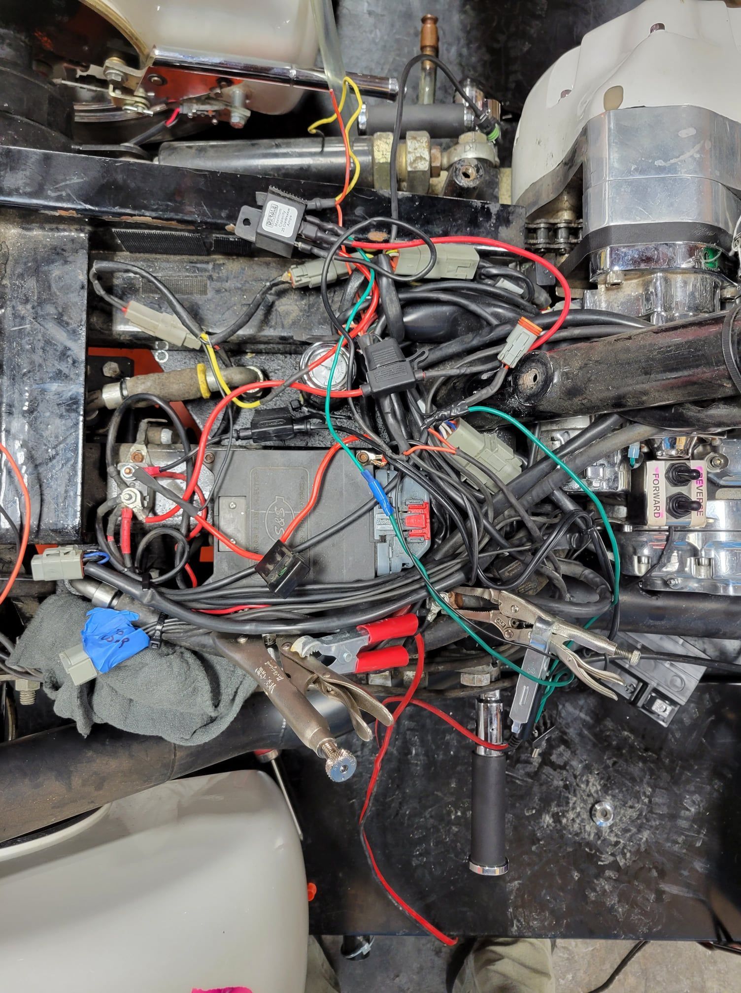 A bunch of wires are connected to a motorcycle engine
