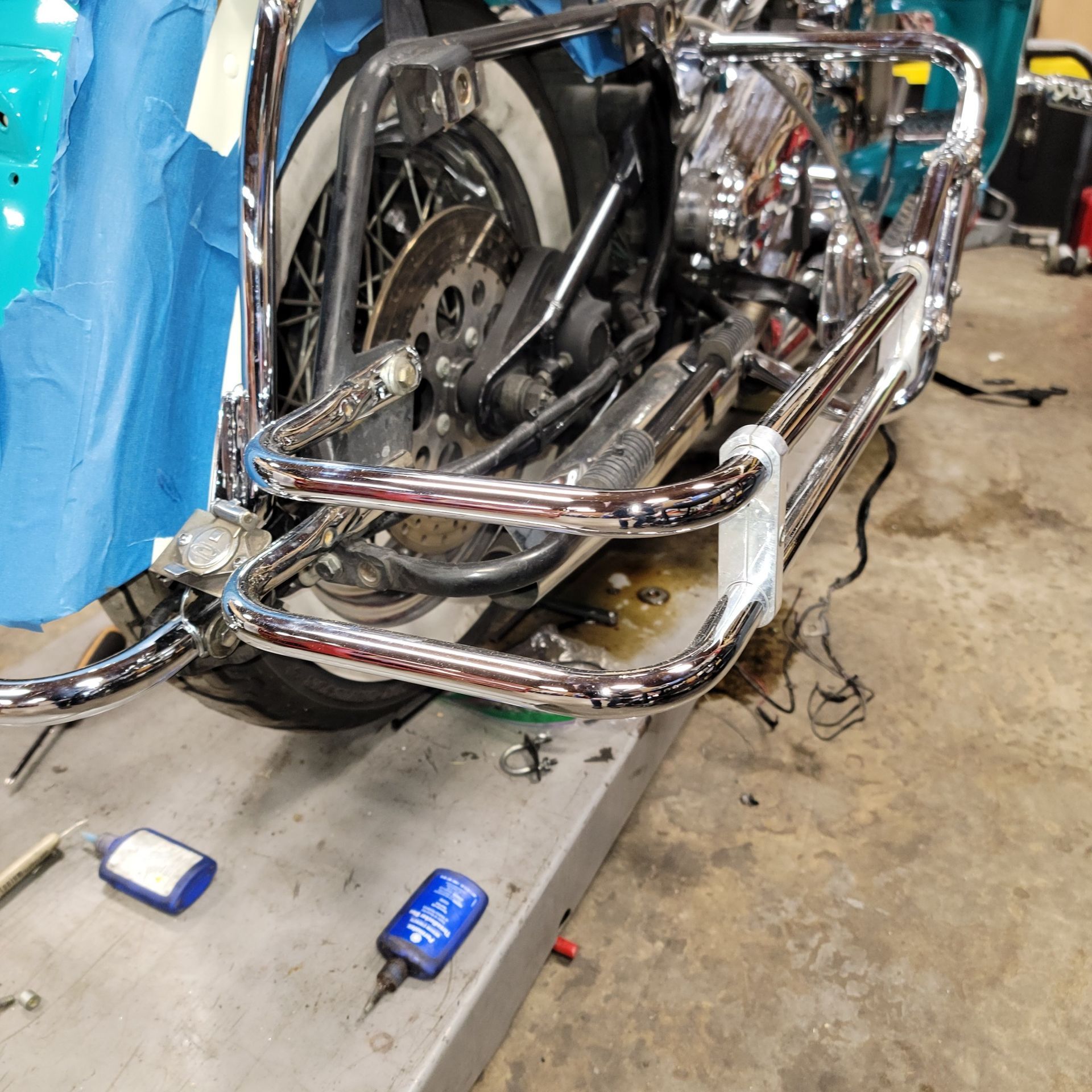 A motorcycle is being worked on in a garage