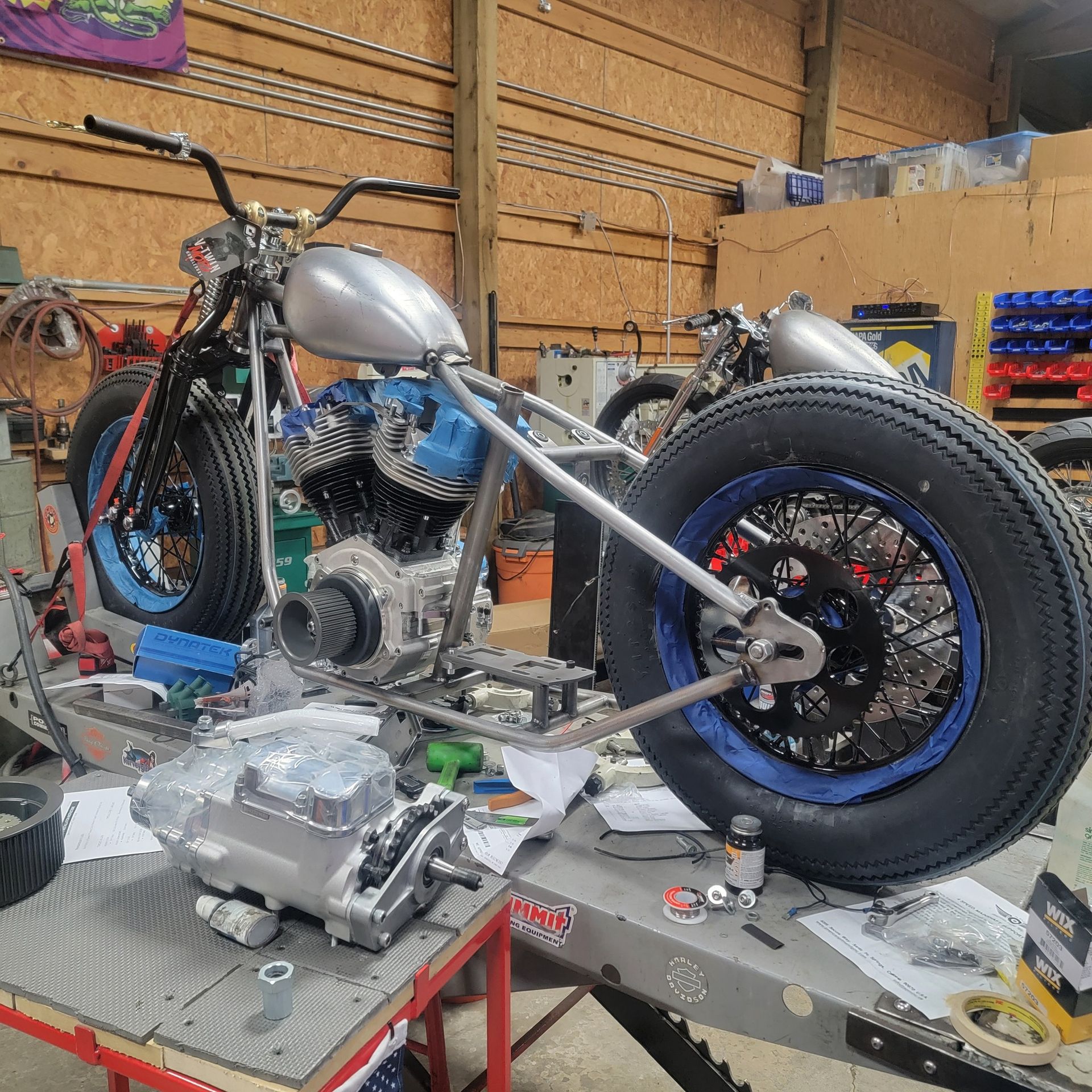 A motorcycle is sitting on a table in a garage
