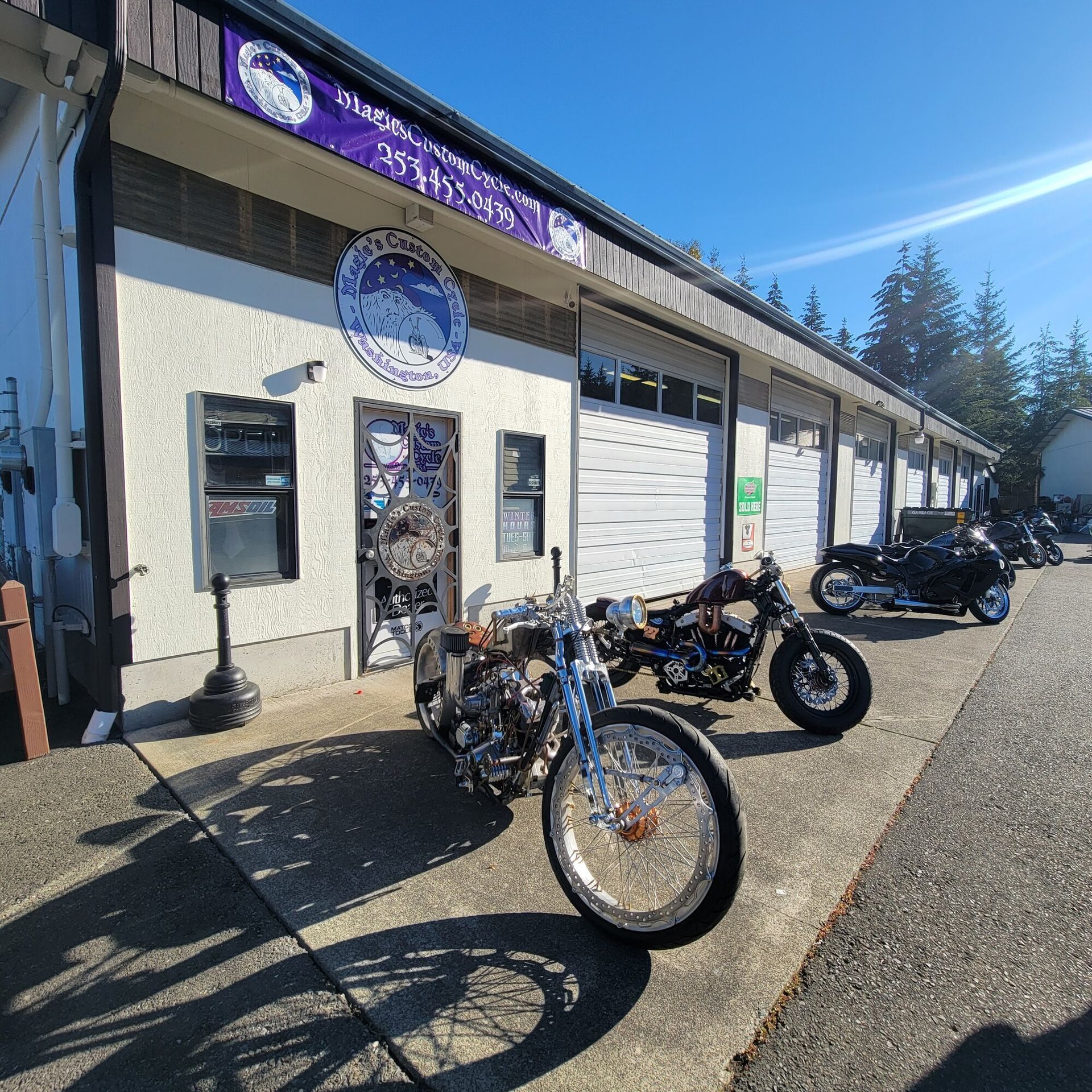 A row of motorcycles parked in front of a building