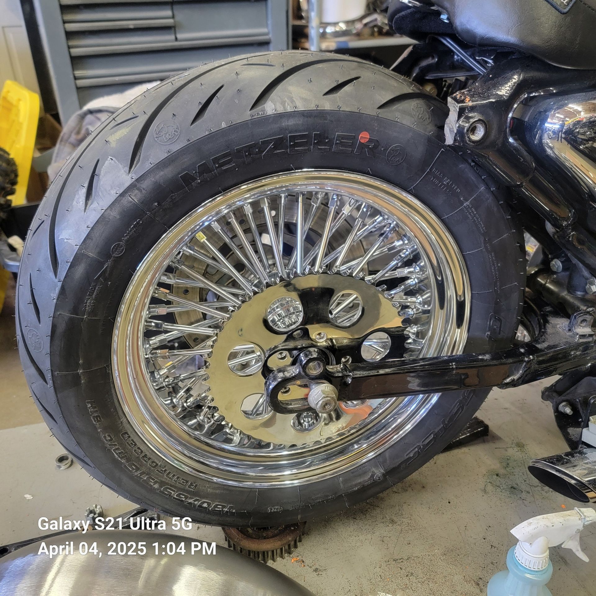 A close up of a motorcycle wheel on a galaxy s21 ultra 5g