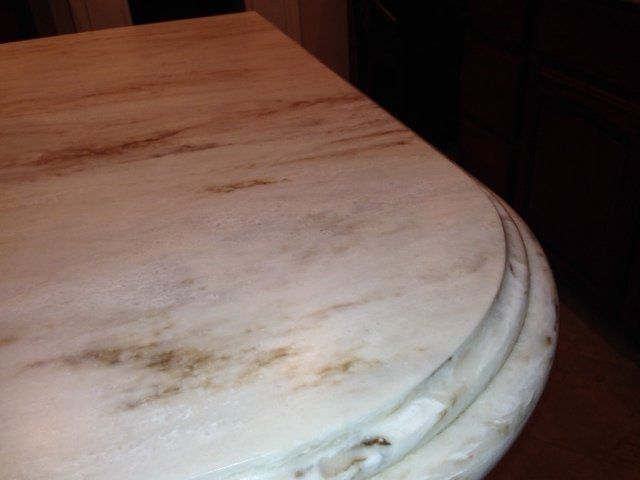 A close up of a white marble counter top