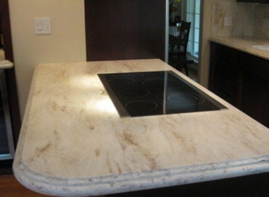 A kitchen counter with a stove top oven on it.
