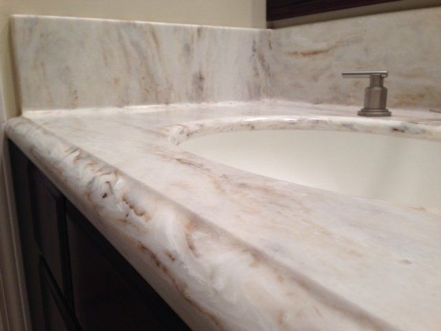 A bathroom sink with a soap dispenser on it