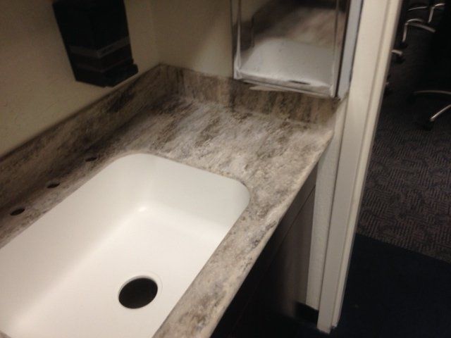 A bathroom sink with a hole in the middle of it