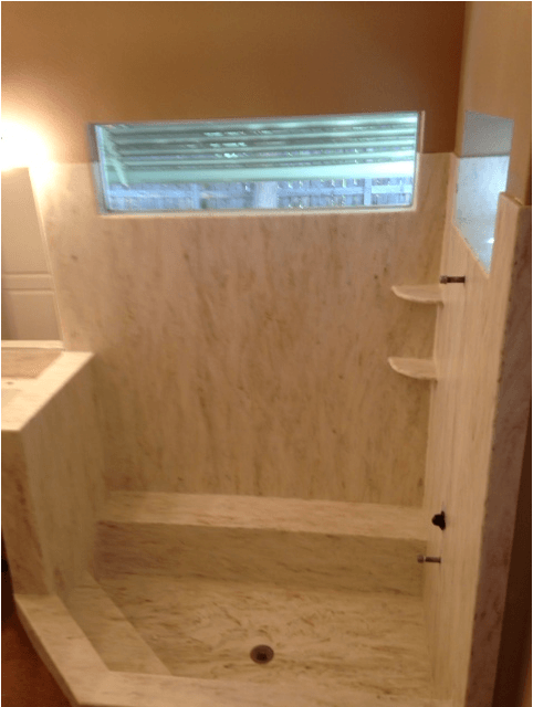 A bathroom with a bathtub and a window