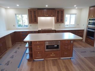 A kitchen with a large island in the middle of it.