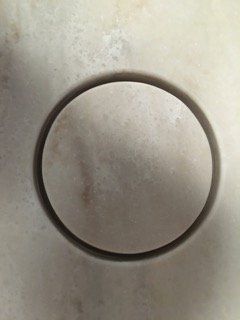 A close up of a circle on a white surface.