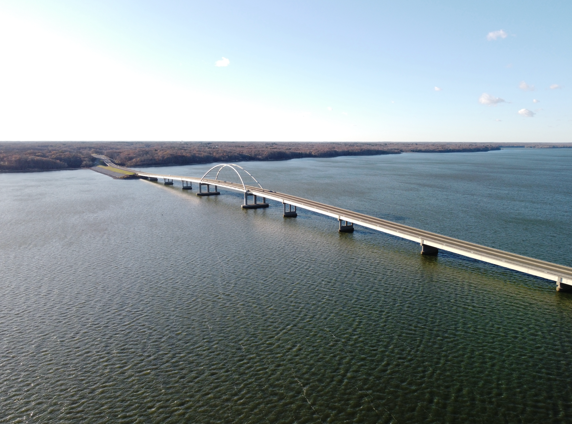 An aerial view of a bridge over a body of water