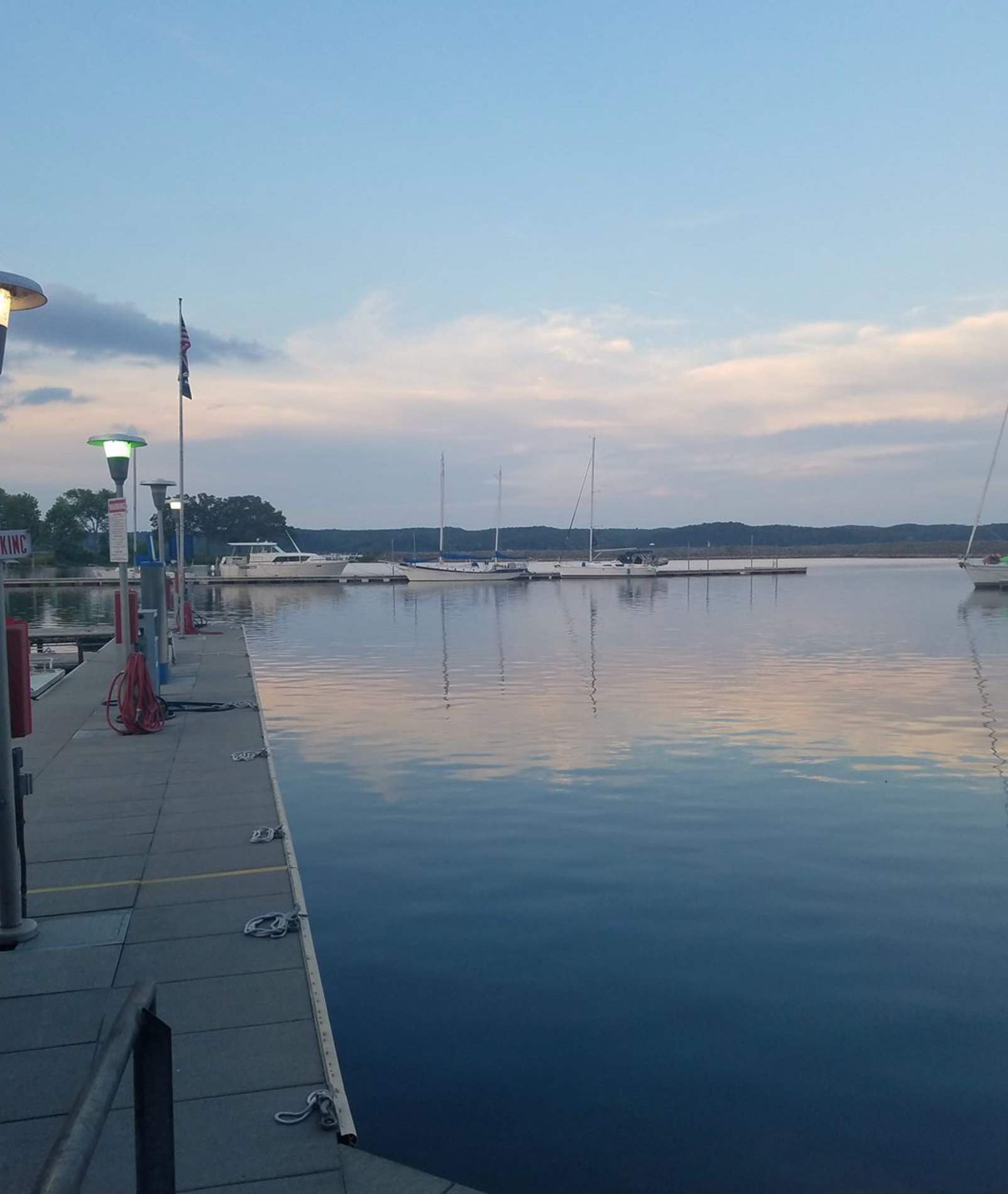 A large body of water with a dock in the foreground