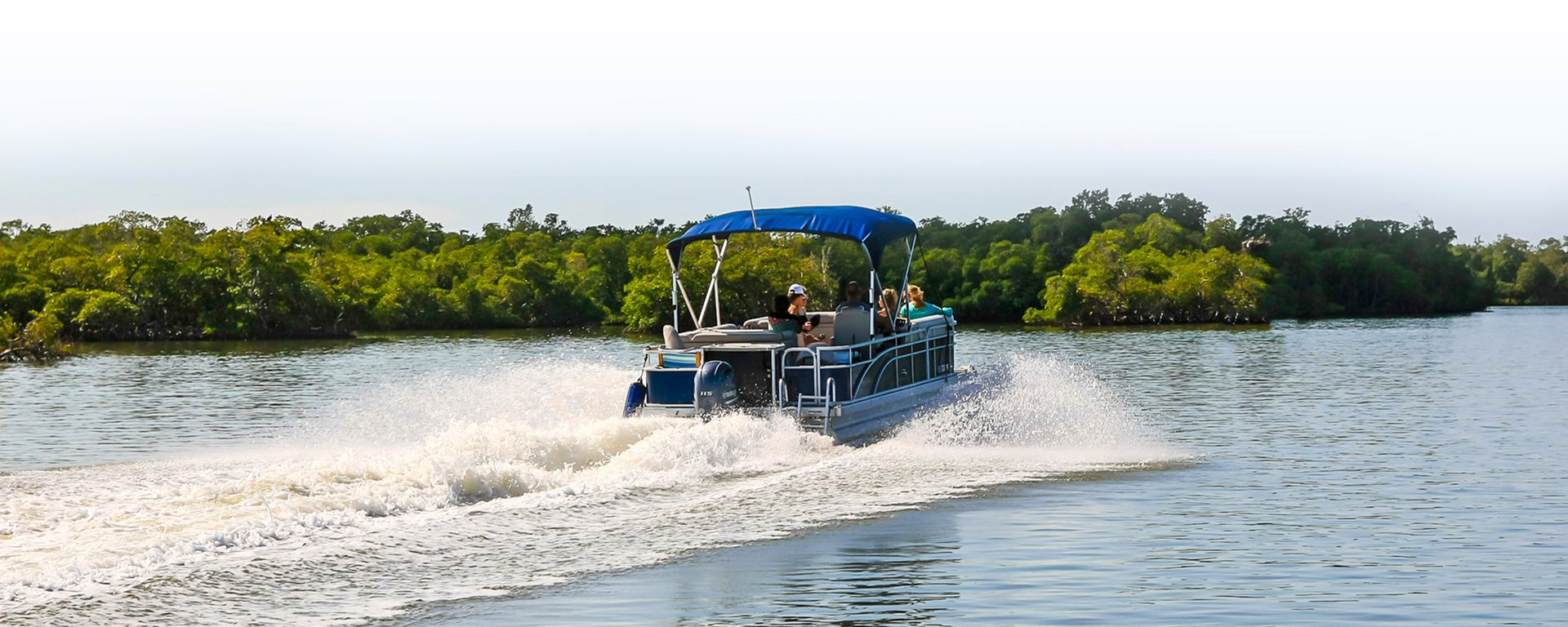 A boat is floating on top of a body of water.