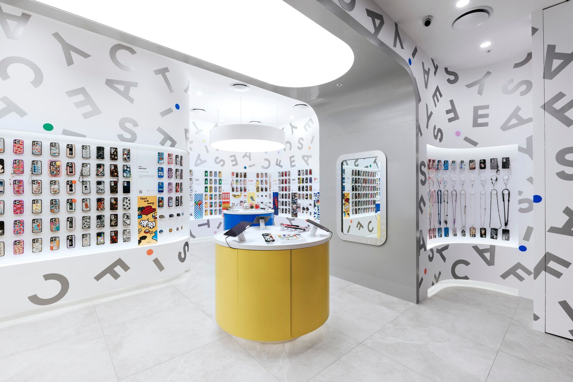Haigh's Chocolates storefront in a mall, displaying chocolates. Features glass windows, black sign, and an empty hallway.