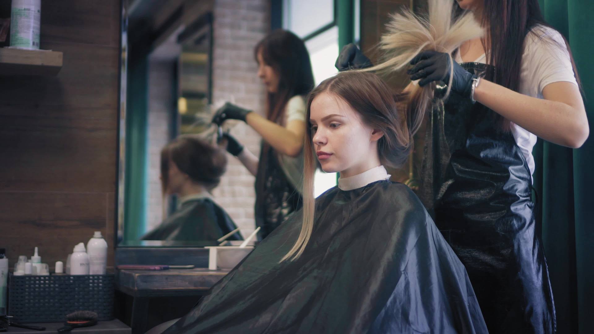 Michigan Hair Salons  — A Girl Getting Damaged Hair Treatment in Waterford, MI