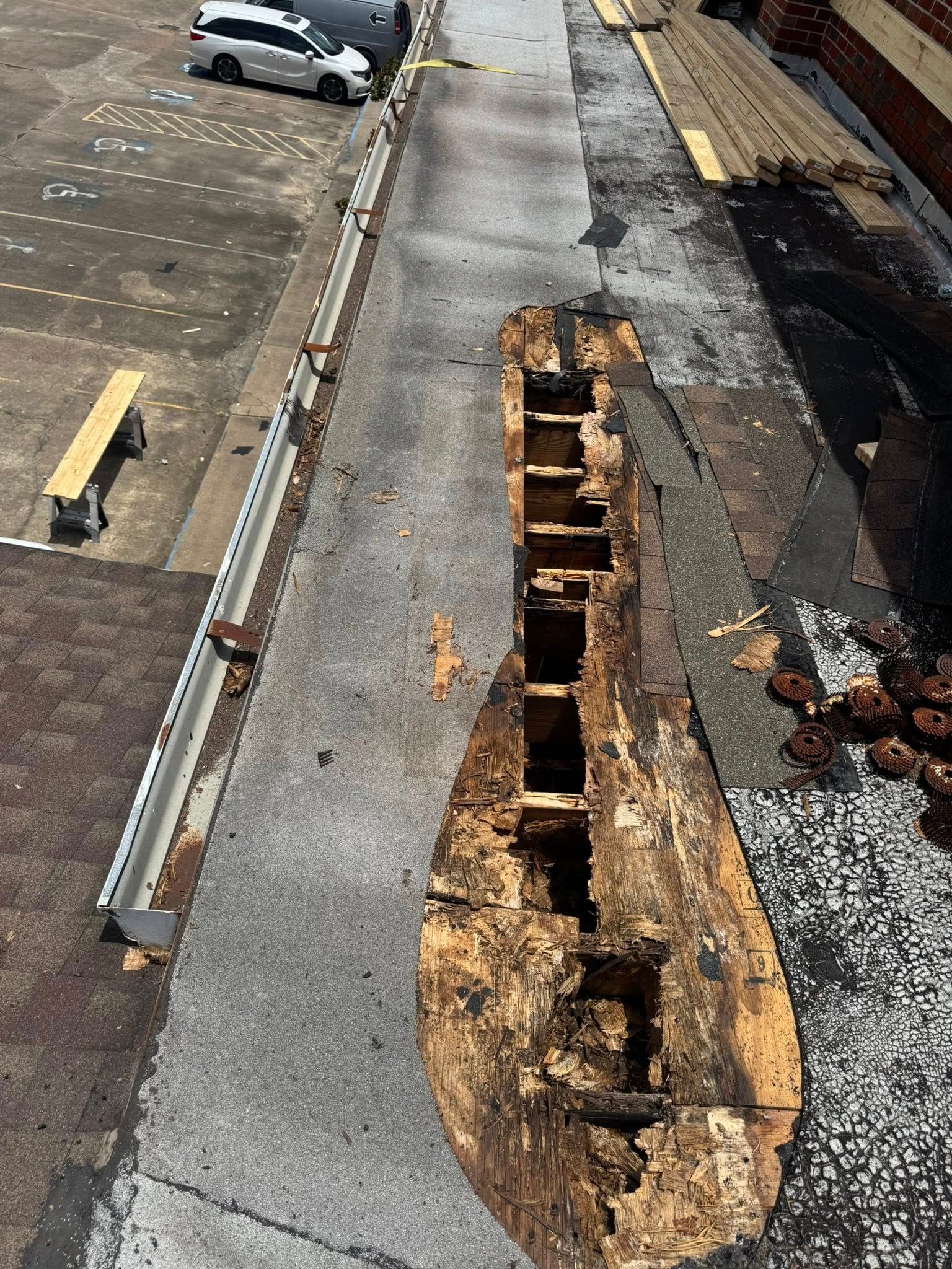 An aerial view of a roof with a hole in it.