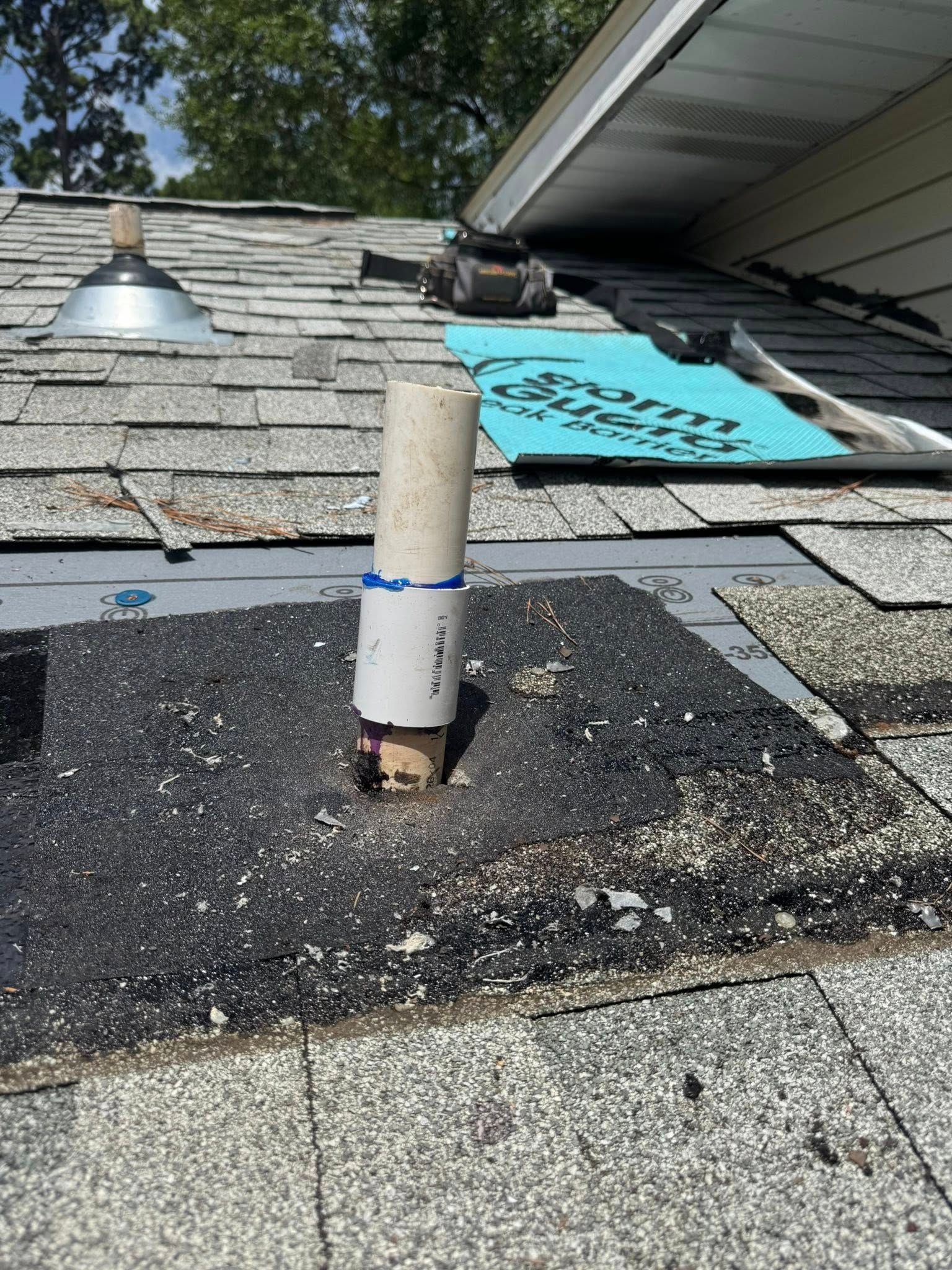 A pipe is sitting on top of a roof.