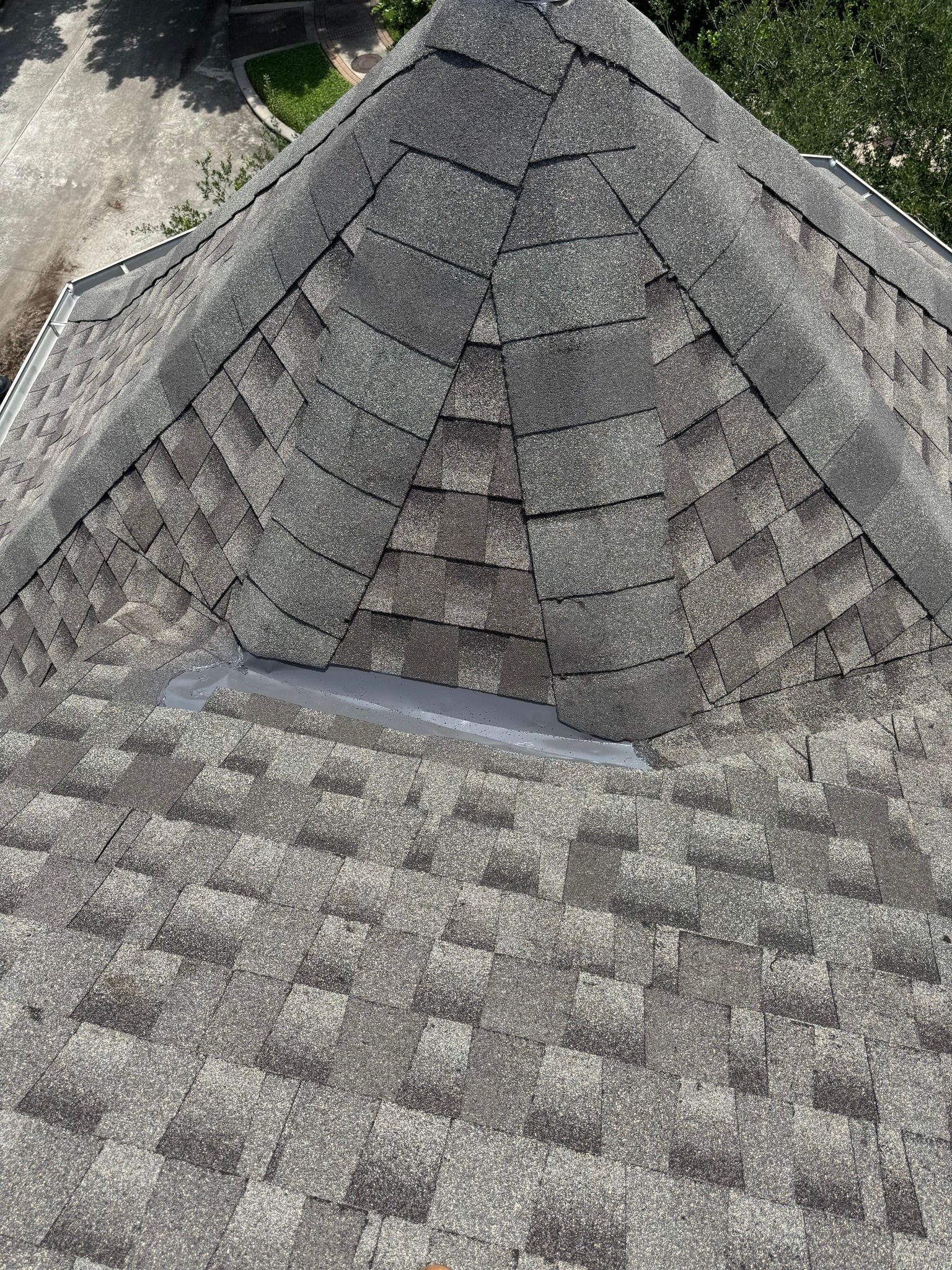 A close up of a roof with shingles on it.