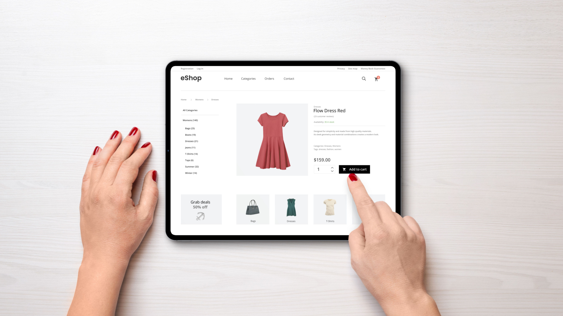 Hands using tablet to shop online; red dress selected on white background.