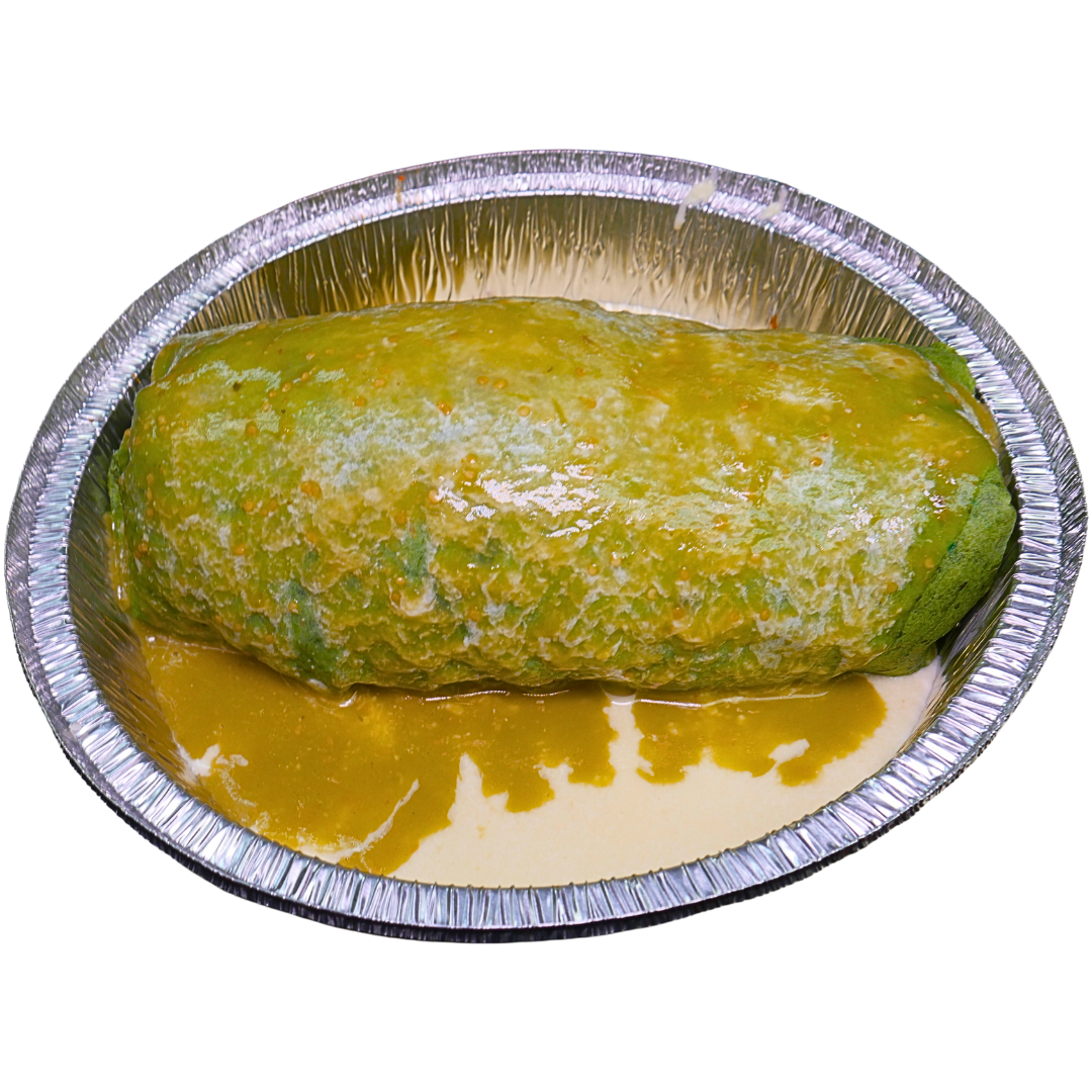 Burrito covered in green sauce in a silver foil container.