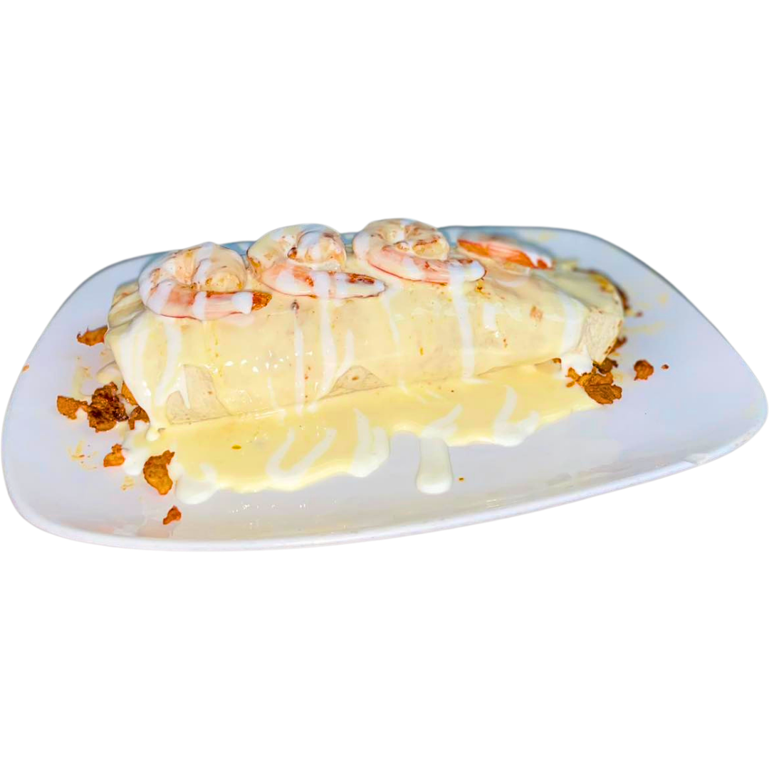 Shrimp burrito with creamy sauce on a white plate, topped with shrimp and crispy bits.