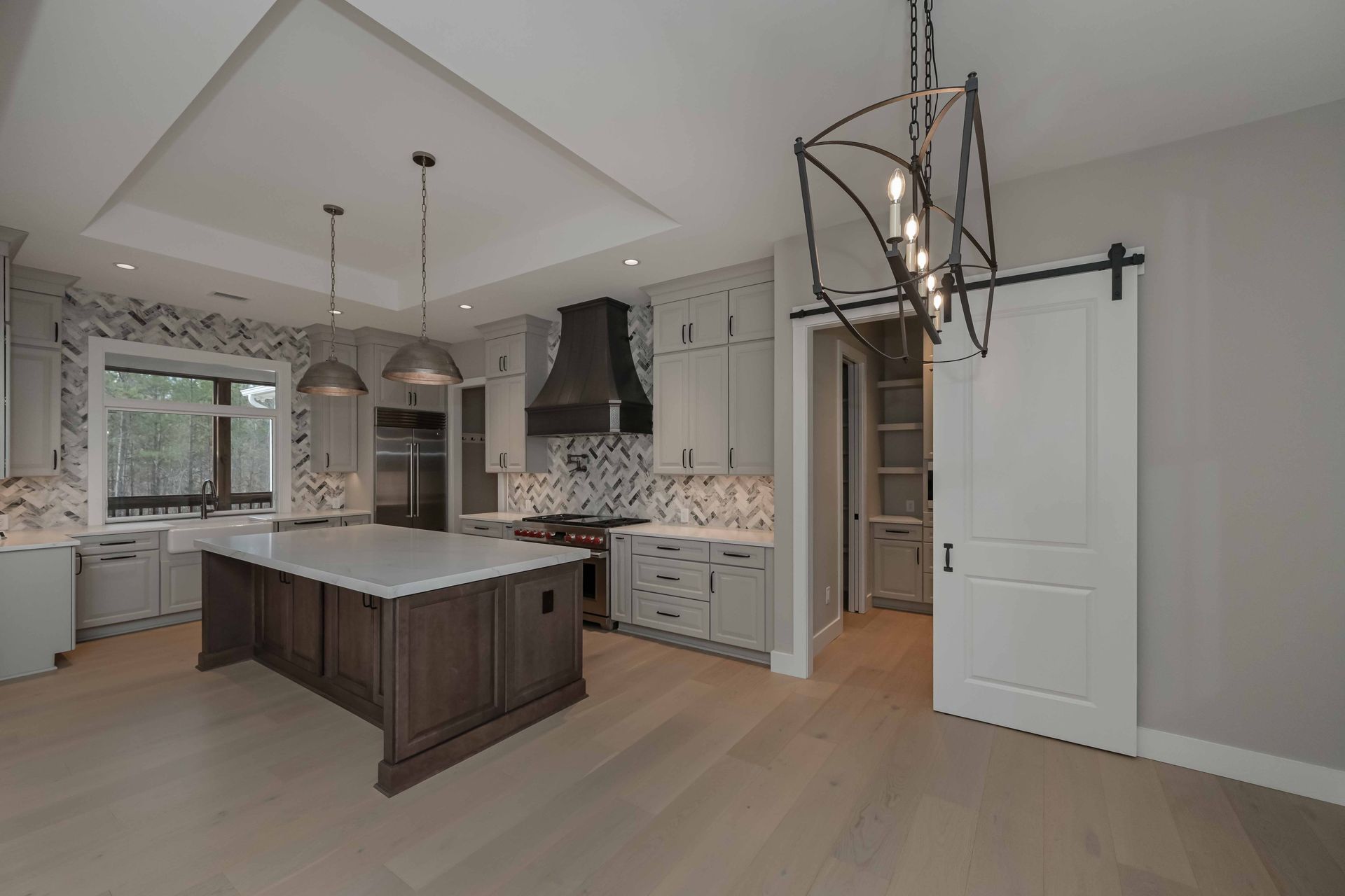 There is a large island in the middle of the kitchen.