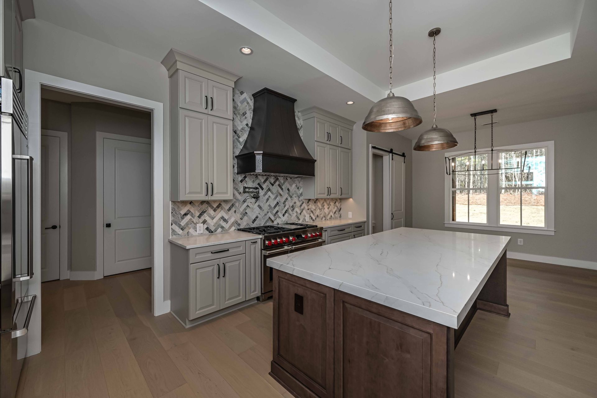 There is a large island in the middle of the kitchen.