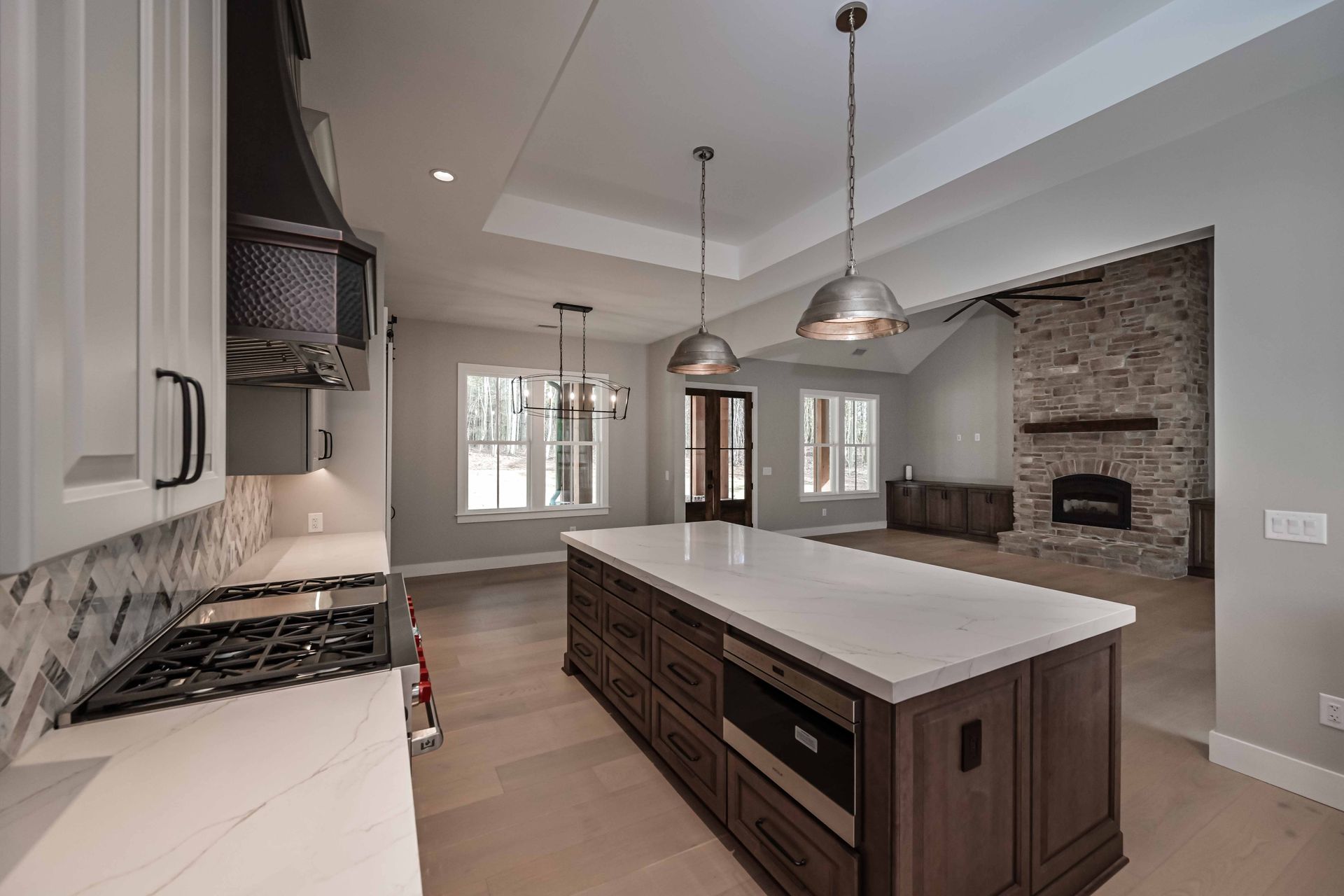 There is a large island in the middle of the kitchen.