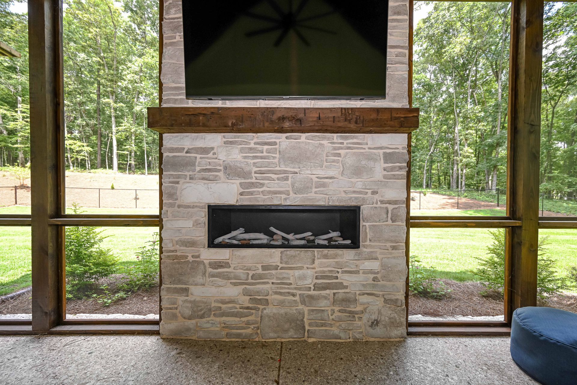A fireplace with a flat screen tv above it