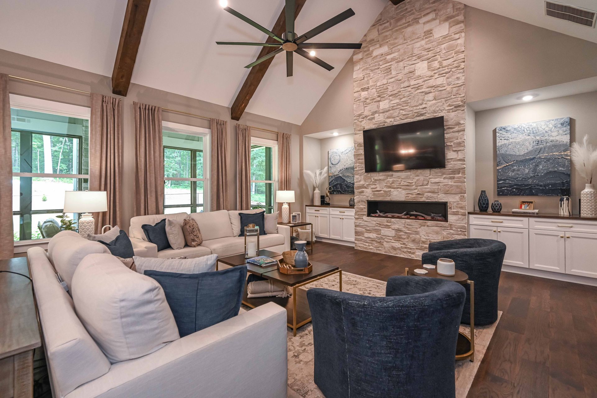 A living room filled with furniture and a fireplace.