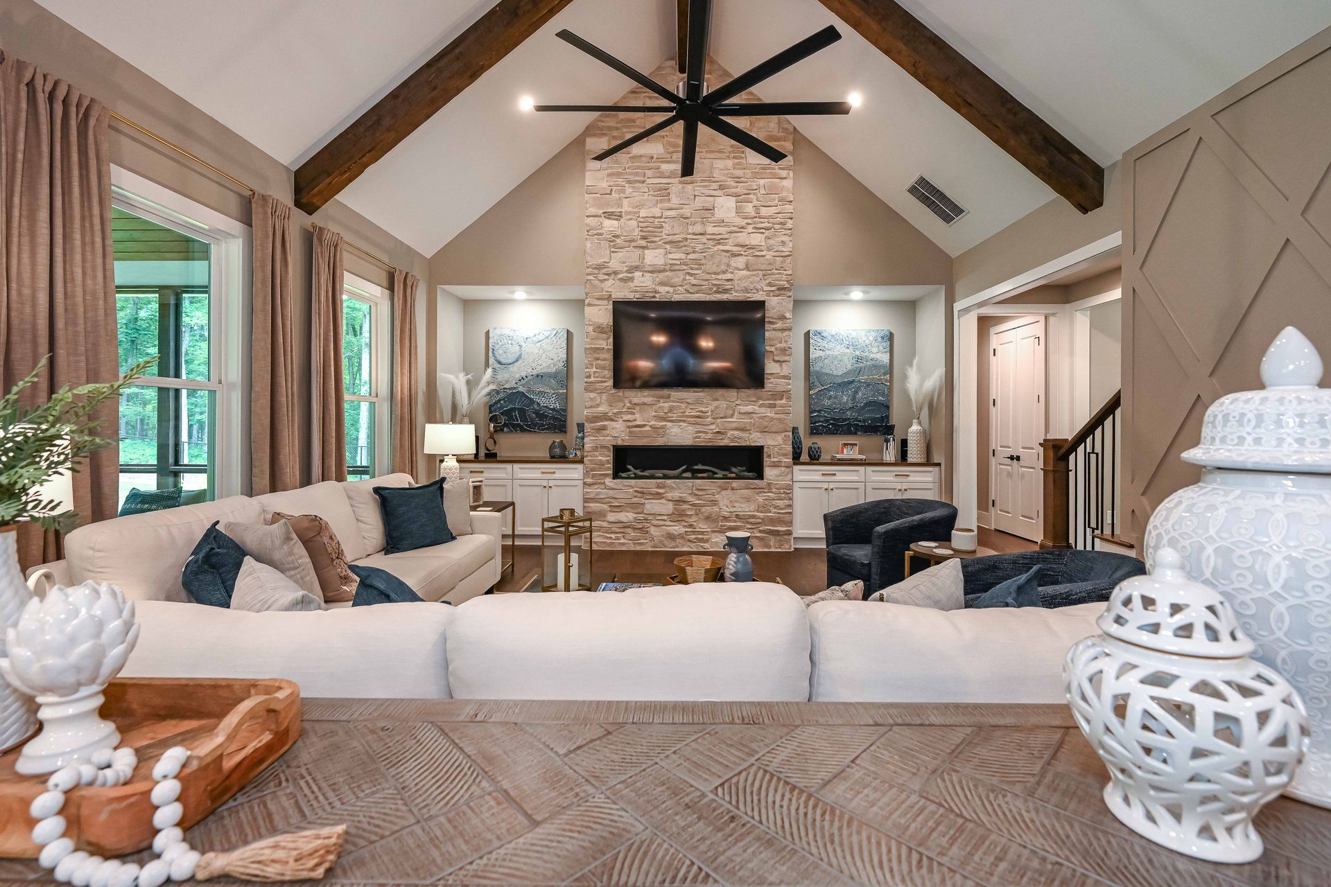 A living room filled with furniture and a fireplace.