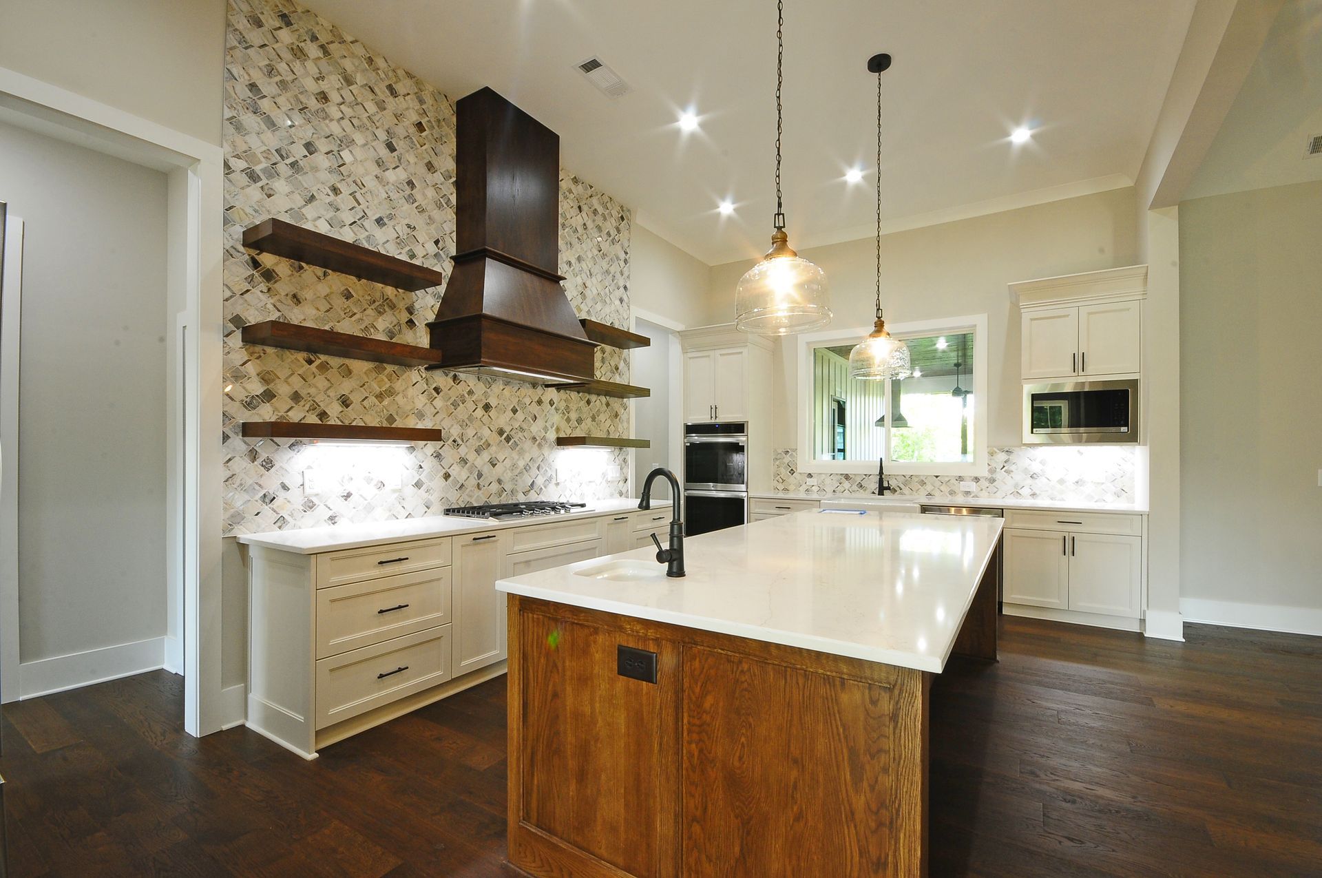 A kitchen with a large island in the middle of it.