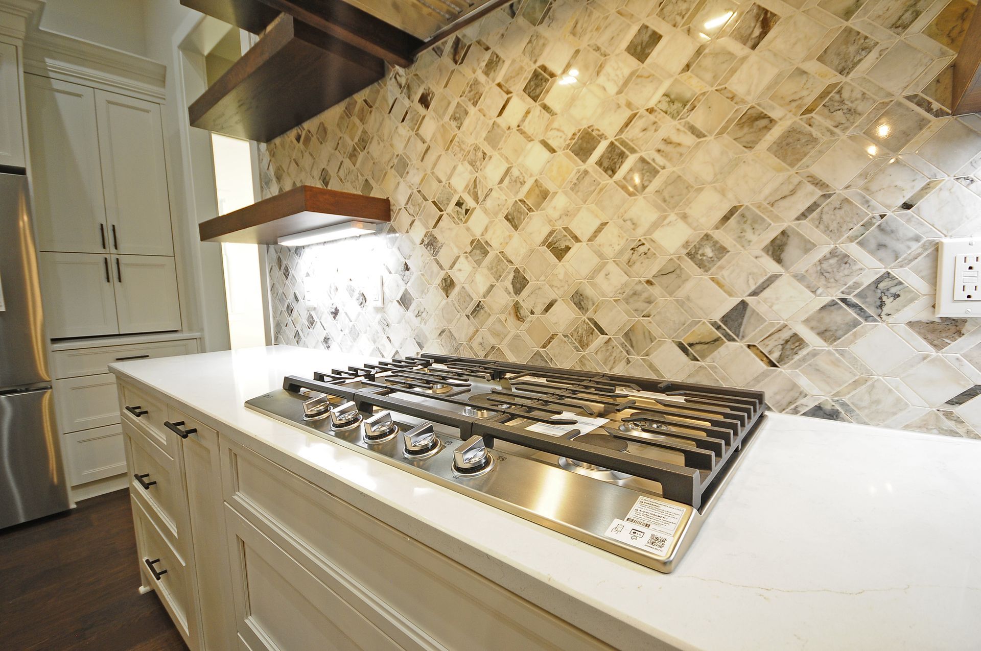 A stove top oven is sitting on top of a counter in a kitchen.