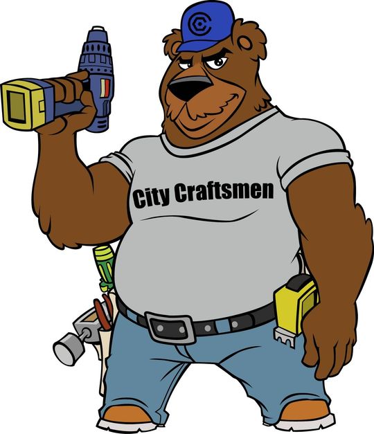 A bear wearing a city craftsmen shirt is holding a drill