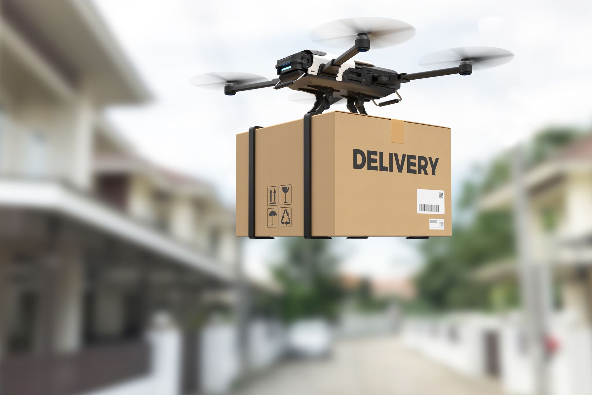 Drone delivering a cardboard box labeled 