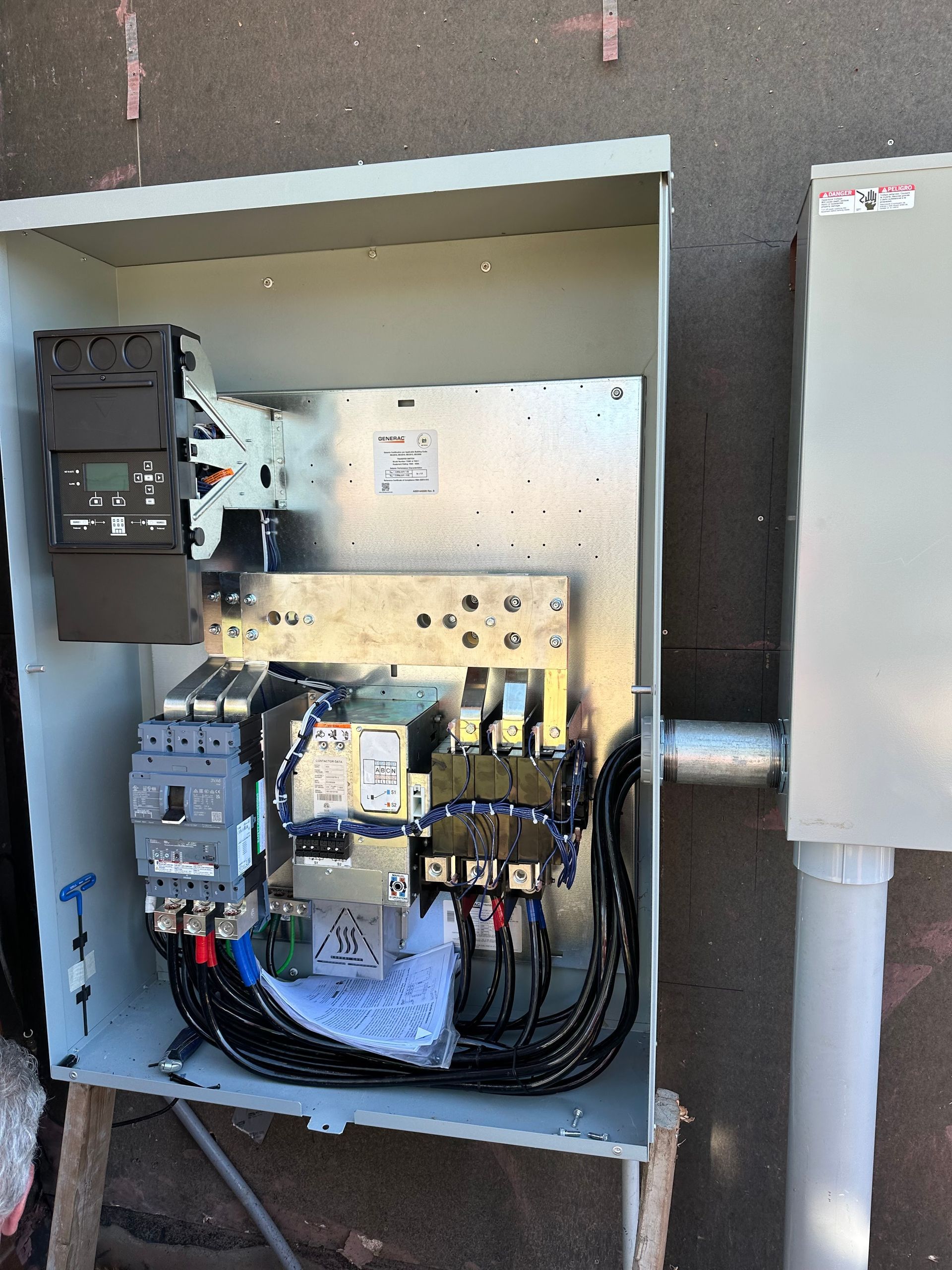 A electrical box with a lot of wires coming out of it