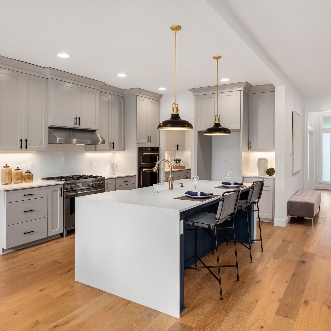 There is a large island in the middle of the kitchen.